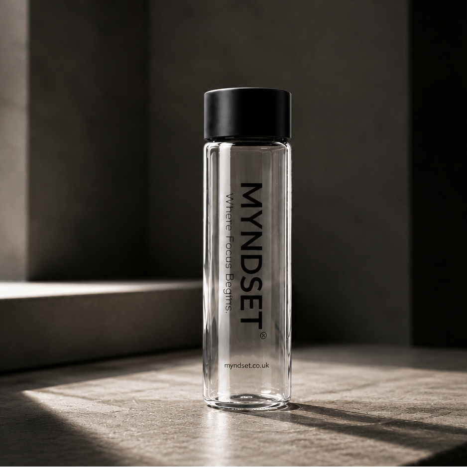 MYNDSET water bottle on a wooden surface with a blurred background